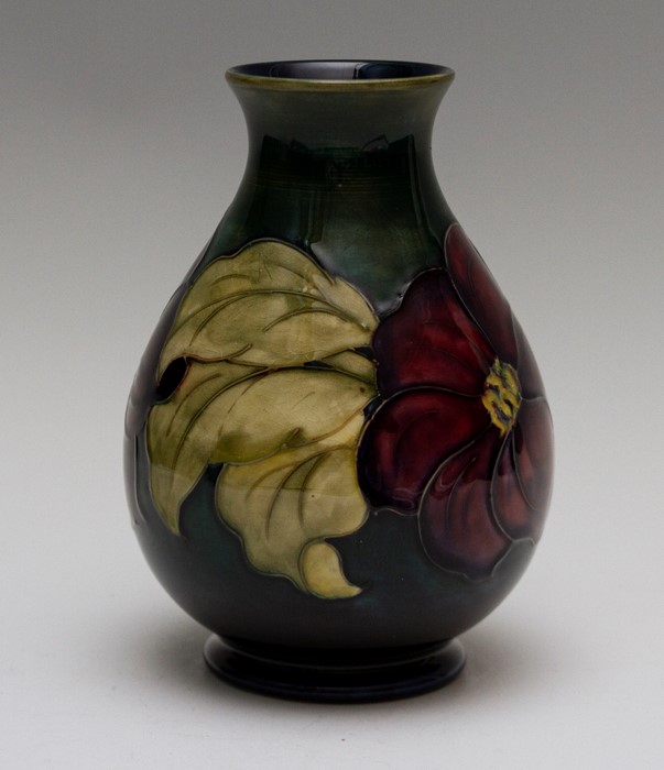 A Moorcroft clematis baluster vase, impressed marks, green W.M monogram, Queen Mary paper label,