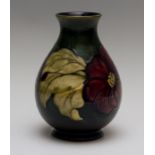 A Moorcroft clematis baluster vase, impressed marks, green W.M monogram, Queen Mary paper label,