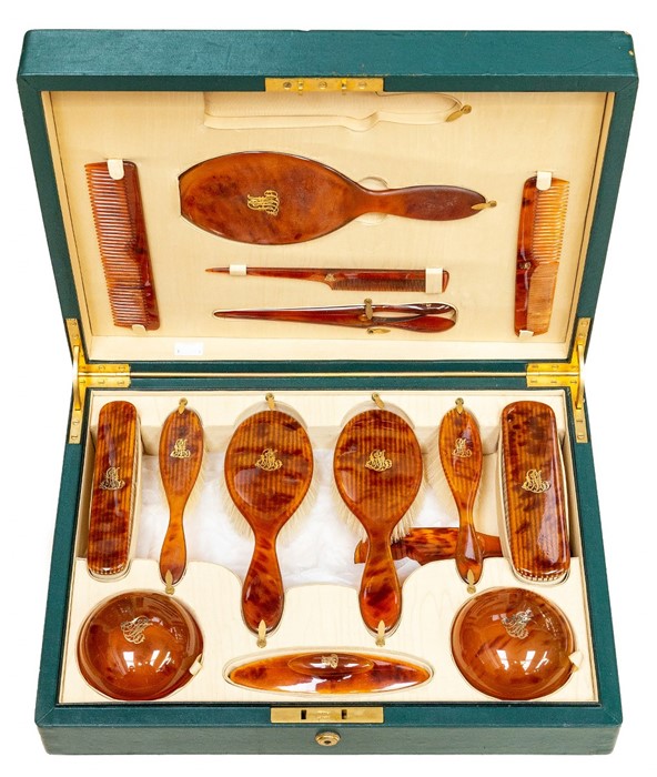 An Edwardian Asprey of London tortoiseshell dressing table set, complete with two hair brushes,