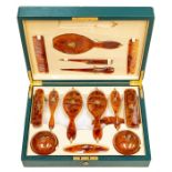 An Edwardian Asprey of London tortoiseshell dressing table set, complete with two hair brushes,