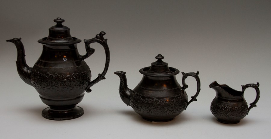 Three pieces of early nineteenth century Jackfield-type wares, circa 1810-30. To include: A low