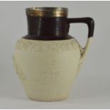 An early nineteenth century saltglazed stoneware Turner jug with metal rim, circa 1800. It is