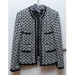 A grey mixed wool jacket with a decorative floral pattern, in grey and black and an embroidered