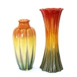 Two Bretby Art Pottery vases of cylindrical form. Both decorated with red, yellow and green glazes
