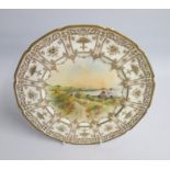 A 20th Century Royal Doulton Plate with a raised Gilded Border. The centre painted ‘’Guernsey Moulin