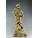 A Bretby art pottery detailed, moulded figure in a Scottish solider's uniform, possibly relating