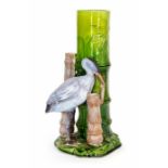 A Bretby Art Pottery Aesthetic Movement spill vase modelled as a heron with bamboo. The heron