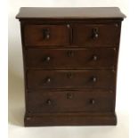 A 19th Century oak collectors chest, in the manner of chest of drawers, serpentine top above two