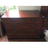 A George III mahogany chest of drawers, circa 1800, fitted with four long graduated drawers,