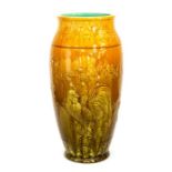 A Bretby Art Pottery large vase with art nouveau motifs to the rim, a cockerel to one side and a