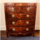 A George III mahogany bow front chest of drawers, circa 1820, satinwood shell inlaid frieze above