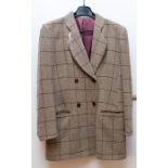 A fawn wool double breasted jacket. The Jacket has a Burgundy check and 4 burgundy buttons 16". A