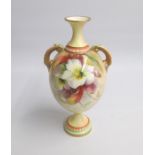 A Royal Worcester Glazed Ivory Twin handled Vase, lavishly painted with flowers Shape 2304 Date: