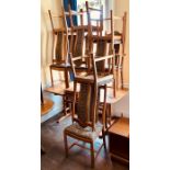 An Ercol elm and ash dining room suite, comprising a set of eight ash dining chairs, consisting of