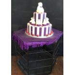 Cake and cage, used for the Baroness’s Birthday party. along with presents.