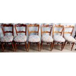 A set of six mid Victorian elm and beech dining chairs, upholstered seats, with a pair of early 19th
