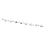 A diamond and 9ct white gold link bracelet, comprising fancy open textured plume links with
