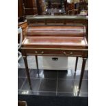 A French mahogany tambour desk, having a marble top, fitted interior, the drawer opening and