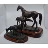 A 20th Century bronzed horse and foal on wooden  base, along with spelter deer on wooden stand,