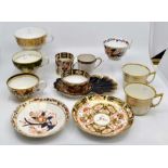 Collection of early 19th Century Derby cups, some with saucers, including Duesbury Imari pattern