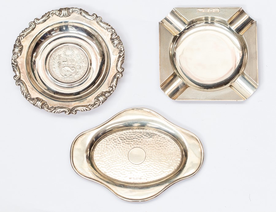 A group of three ashtrays to include a silver Boodle & Dunthorpe ashtray, Birmingham 1954 square