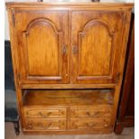 A 20th Century TV cabinet, the doors folding back and revealing a large interior space, together