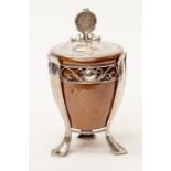 An Arts and Crafts silver mounted stoneware jar, the hammered silver cover surmounted by finial