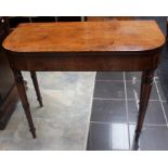 A George III mahogany fold over card table, circa 1810, having mahogany banding to edges, replaced