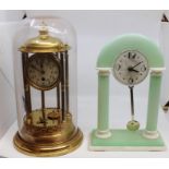 An Art Deco style clock plus an Anniversary clock under a dome