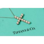 Tiffany & Co - a diamond set Tiffany & Co platinum cross pendant, with eleven round brilliant cut