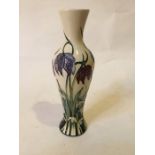 A limited edition Moorcroft vase with detail of flowers including snowdrops and snakes head with