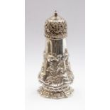 An early Victorian silver pepper pot, tapered body chased with leaves in high relief, by Henry