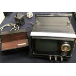 A 1970s Santo Solid State Cadnica Portable 5 television, Model No 5-TC1, serial number 4507081 and a