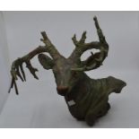 Cast iron stags head along with mounted bulls horns