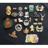 A collection of mixed reproduction and some original military badges to include repro Third Reich.