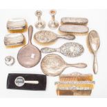 A collection of Edwardian and later sterling silver dressing table items, including brushes,