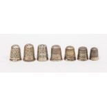 A collection of thimbles to include three by Charles Horner with floral decoration along with four