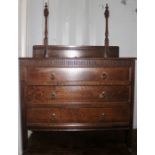 An early 20th Century oak bedroom chest, fitted with three long drawers, raised on square legs, 90cm
