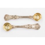 Two silver salt spoons with gilt bowls, hallmarked London 1834 and 1864, approx 60gms