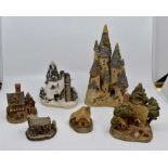 A collection of David Winter sculptures, comprising The Bakehouse, Humble Home, Snow Cottage,