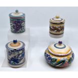 Three Poole Pottery jam pots together with a box and cover, all marked to base Condition: No obvious