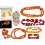 A collection of beads including a graduated butterscotch amber type necklace, total gross weight