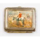 A late Victorian white metal cigarette box, the cover inset with silk print depicting huntsmen and