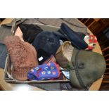 A collection of hats to include, vintage, Tirolean and Swiss (with badges) Afghan, naval and