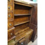 An 18th Century style joined oak dresser and rack, of recent manufacture, traditionally made, the
