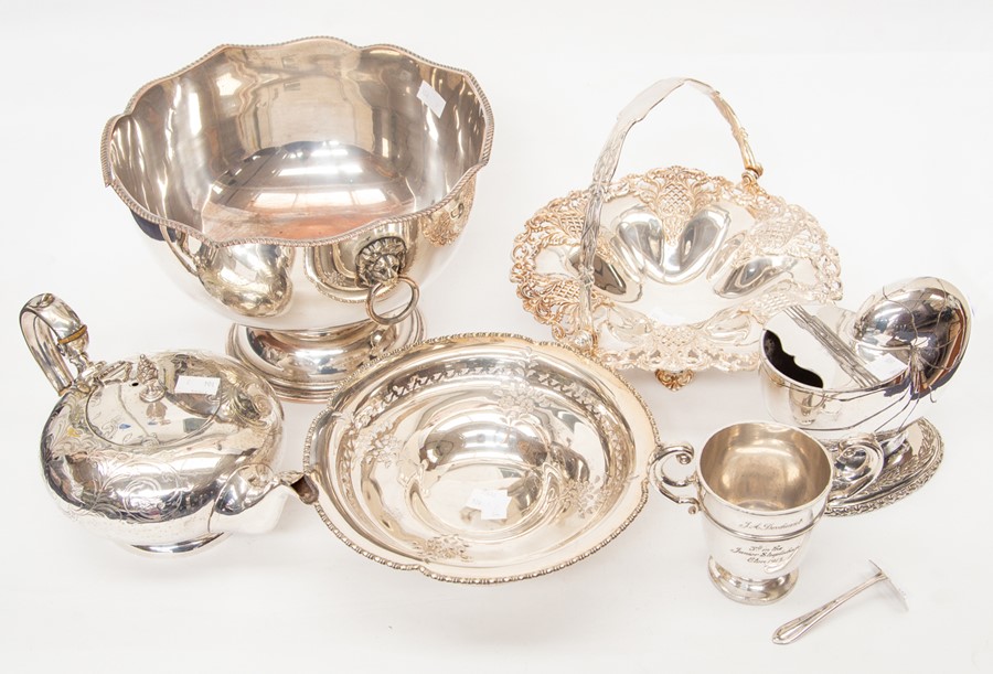 A collection of silver plated items including spoon warmer, punch bowl, two fruit bowls, teapot