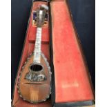A late 19th Century Italian rosewood cased mandolin, spruce top front, ebony and mother of pearl