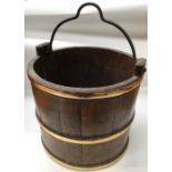 Wooden coal bucket, metal handle, three brass bands.