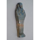 An Ancient Egyptian Shabti, composite and glazed in a turquoise colourway, carved detailing, 21cm