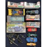 A collection of vintage Scalextric cars, boxed and unboxed, along with Airfix and a steam engine